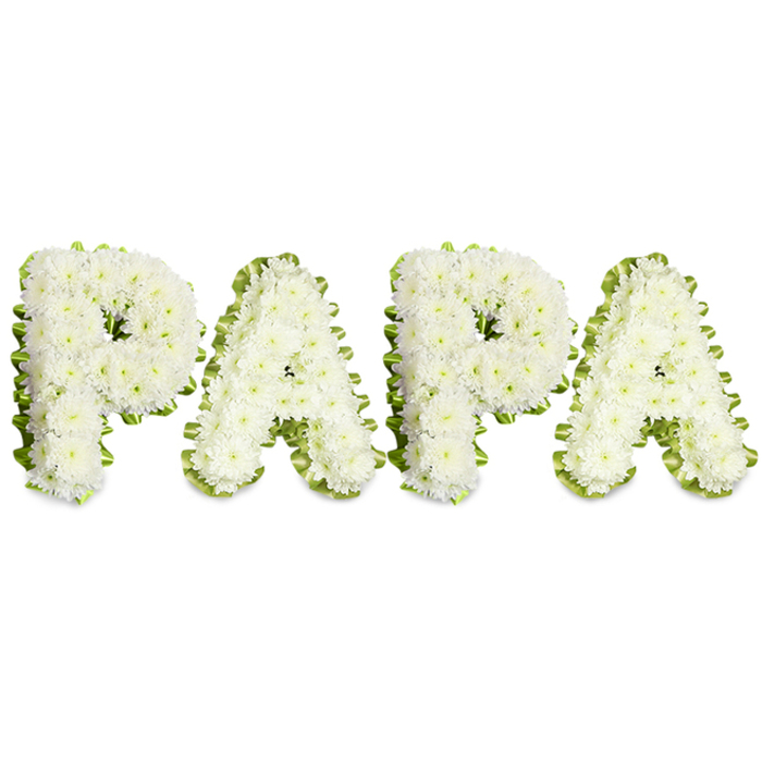 An elegant, solemn floral tribute formed to spell the affectionate name PAPA in uppercase letters, each character crafted from clusters of immaculate white chrysanthemums. The small, tightly clustered blooms create a plush, slightly raised surface that looks soft to the touch, while subtle nuances of cream and pearl within the petals catch soft studio light against the stark white backdrop. The edges of every letter are neatly outlined with a pale lime-green pleated ribbon or narrow foliage, lending a crisp, subtle frame that enhances legibility without intruding on the piece's quiet grace. The letters are arranged horizontally, their rhythm deliberate and even, reflecting careful planning and the steady hand of an experienced funeral florist.
This design reads as an intimate and respectful farewell, chosen to honour a father, grandfather or paternal figure with clarity and love. The fragrance is gentle-notes of chrysanthemum that bring a comforting earthiness rather than perfume-and the white-and-green palette evokes serenity and remembrance. For families in New Barnet and those who gather near Monken Hadley Common or the local church halls, this kind of personalised floral lettering provides a simple, powerful statement of devotion and respect. It is the kind of arrangement offered with quiet compassion by local florists, designed to sit gracefully among tributes and to convey enduring affection in a time of farewell.