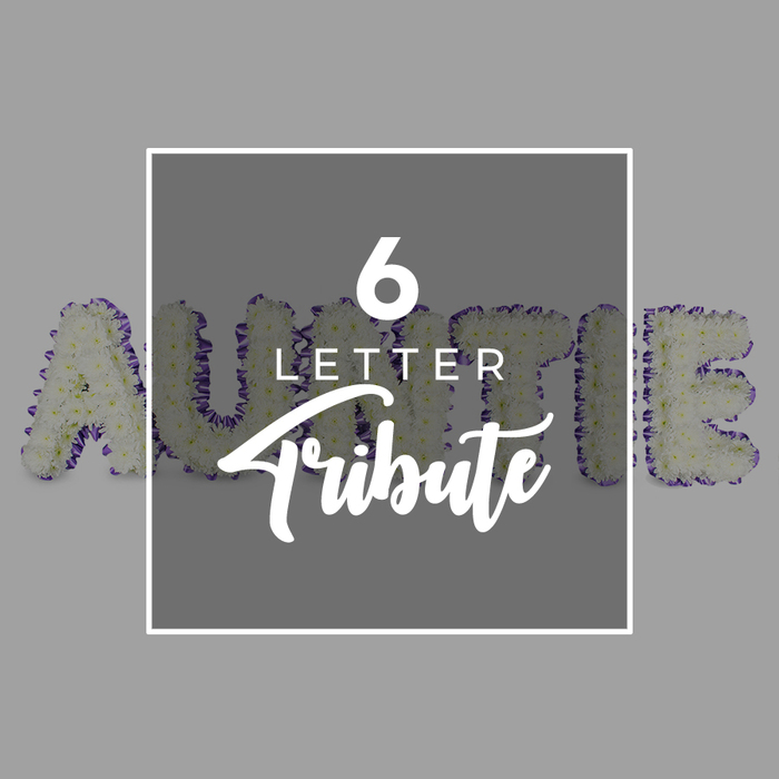 A poignant, composed tribute spells AUNTIE in six freestanding letters, each one built from a dense, pristine cluster of white chrysanthemums. The effect is full and tender, a soft-white field that radiates calm and remembrance. A slim border of purple blooms or ribbon traces the edges of every letter, adding color depth and a sense of refined definition to the arrangement. Superimposed over the center is a square white frame, within which the text 6 LETTER appears in a clean sans-serif type, followed by the word Tribute in an elegant script, highlighting the theme of a customized memorial piece. The neutral gray backdrop allows the white blooms to glow softly, evoking a serene atmosphere ideal for a funeral service, wake, or memorial moment in New Barnet. This personal, handcrafted design speaks to the enduring bonds of family and the special place an Auntie holds. Crafted by a local floral studio, it embodies careful artistry, gentle fragrance, and a sense of timeless dignity. Delivery across New Barnet and nearby districts is available, ensuring the tribute arrives with care when it matters most.
