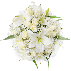 Seen from above on a spotless white field, this hand-gathered round bouquet presents a chorus of white and cream blooms arranged with thoughtful balance and restraint. Several large oriental-white lilies claim attention with their sweeping, trumpet-shaped petals and softly coloured stamens, each bloom catching light on its broad, silky surface and giving off a delicate, honeyed scent that complements the more subdued perfume of the roses. Scattered among the lilies are numerous cream and ivory roses, many in tight bud form or gently opening, their velvety layers creating small, tactile domes that invite touch. Intermittent clouds of baby's breath (Gypsophila) breathe through the composition, lending an almost snowy texture that cushions the larger flowers and lends the bouquet an overall softness. Fresh, bright green leaves frame the ring of flowers and peek from beneath, providing a cool, grounding contrast to the monochrome palette. This arrangement reads as a classic bridal posy, a serene sympathy tribute, or an elegant centrepiece for a celebration held around Station Road or the leafy paths of Oak Hill Park in New Barnet. Crafted with local care by Flowers New Barnet, the bouquet balances formal symmetry with an intimate, neighbourhood warmth, the kind of floral statement that feels at once ceremonial and personally reassuring to those who know the area.