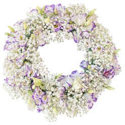 A delicate sympathy wreath sits alone on a crisp white background, its flawless circular shape made entirely of fresh white and purple flowers, as if a soft ring of cloud had been gathered by hand in New Barnet. The base of the wreath is densely packed with Baby's Breath, thousands of tiny Gypsophila blossoms clustered so closely that they form a plush, snowy cushion. Each small bloom adds to the impression of a gentle haze, giving the wreath a lightness that contrasts with the depth of emotion it represents. Scattered thoughtfully across this frothy white texture are Lisianthus blooms, their ruffled petals unfolding in elegant spirals. The petals begin as clean white and then are traced with lilac, lavender, and deeper purple around the edges, creating subtle gradients of colour that feel both refined and soothing. Some blossoms are wide open, showing layered centers and a darker heart, while others remain in bud or half-open, tipped with pale green and cream, suggesting quiet, ongoing life within the design. The central opening of the wreath is broad and uncluttered, highlighting the classic memorial shape associated with eternity and unbroken love. Without any backdrop apart from pure white, every nuance of petal, shadow, and hue is clearly visible, drawing attention to the careful artistry a New Barnet florist would invest in a funeral or memorial tribute, suitable for services near Hadley Common or High Barnet. The overall impression is of calm, comfort, and a dignified farewell expressed entirely through flowers.