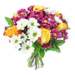 Set against a spotless white background, this mixed flower bouquet appears almost to float, its colours and shapes forming a lush, rounded silhouette that fills the frame. The stems are gathered tightly at the base, cut clean and straight, showing off the skill of a professional florist used to preparing hand-tied gifts for homes and offices around New Barnet. Dominating the design are several luxurious roses with bi-coloured petals, glowing from a sunny, golden yellow at their centres to richer orange and subtle reddish-orange along the outer edges. Their full, spiralling blooms create a sense of warmth and gentle celebration, as if they have just opened to their peak. Interlaced throughout are bright white daisy-style chrysanthemums, each with a sharp ring of petals surrounding a bold lime-green eye. These fresh, zesty centres echo the leafy greens and provide a light, uplifting contrast to the deeper rose tones. Adding drama and richness, small yet vivid magenta or fuchsia chrysanthemums are tucked in generous clusters, their many fine petals forming rounded heads with cheerful yellow-green centres. Their intense colour feels like gemstone sparks scattered across the arrangement. Slender, dark green foliage, akin to ruscus, emerges between the flowers, creating depth and a natural rhythm, while keeping the emphasis firmly on the colourful blooms. The bouquet radiates an exuberant yet polished mood, well suited to celebrating milestones, welcoming a new baby, or simply sending a cheerful surprise to a friend near New Barnet station or around Victoria Park. It evokes feelings of happiness, appreciation, and bright, everyday luxury.