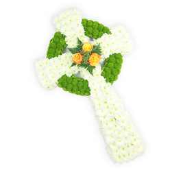 Set on a luminous white background and photographed slightly from above, this floral Celtic cross reads as both classic and contemporary, fashioned entirely from fresh blooms arranged with surgical care. The structural mass is created by tight clusters of pristine white spray chrysanthemums whose soft, feathery petals form a plush, cloud-like surface across the arms and shaft. Interlaced within that pale canvas are sections of bright apple-green button chrysanthemums; these neon-toned, globe-shaped flowers define the circular centre and alternate bands along the horizontal arms, providing a lively sculptural outline and a tactile contrast that draws the eye around the cross. Anchoring the composition at the meeting of the arms are three rich orange-yellow roses, placed as an intentional, heart-warm focal cluster-their layered petals offering a gentle perfume that lifts the arrangement's quiet solemnity. A few deep green fern fronds nestle the roses and add slender, graceful movement, their texture deepening the composition. The colours-white, green, and orange-subtly echo Irish heritage and give the piece extra resonance at memorials or services for those with Celtic roots. The lighting is soft and even, allowing every petal and bloom to read clearly, as you might expect from a New Barnet florist preparing tributes for a funeral near New Barnet Station or a chapel service by the High Street. This arrangement feels respectful and consoling, crafted to convey memory, faith, and enduring affection.