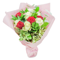 Carefully hand-tied by our New Barnet floral experts, this bouquet is a study in timeless elegance and heartfelt artistry. Rich, velvety red roses nestle seamlessly beside creamy white blooms, their contrasting hues creating a gentle yet dynamic interplay, much like the distinctive rhythm of Meadway or East Barnet Road nearby. The roses' petals appear luminous in soft daylight, their freshness underscored by crisp green foliage, subtle eucalyptus, and touches of cream-tinged variegated leaves. Gentle sprigs of greenery arc above the dome of blooms, each frond adding movement and fullness, reminiscent of the layered canopies in Victoria Recreation Ground. The bouquet is cocooned in blush-pink wrapping, gathered and tied with subtle finesse, its translucent folds catching light just as morning sun filters through the trees of New Barnet. The scent is fresh and uplifting, mingling the sweet notes of roses with earthy botanical undertones. This arrangement is suffused with emotion-a fitting gift for life's celebrations, be it a birthday, an anniversary, or to brighten someone's afternoon. Effortless yet refined, it brings a story of connection from our floral studio to your doorstep, reflecting the thoughtful spirit of New Barnet in every detail.