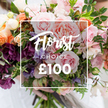 A close, tender portrait of a hand-tied florist's choice bouquet, its blooms arranged like a secret garden held softly in two hands. At the centre of the image a white rectangular overlay frames the words Florist Choice in an elegant script, with CHOICE in small caps beneath and the price shown as ?100 in bold numerals, clearly signalling the florist-selected offer. The bouquet itself reads as a study in texture and gentle contrast: large, velvety pink garden roses open in layered ruffles, their perfume almost visible; interwoven are plum-toned hellebore-like florets that anchor the palette with deep, dusky colour. Narrow, striped sweet peas in pale purple and white drift upward with an airy, delicate presence, while peach and coral ranunculus-style blooms add warm, buttery layers. Small creamy white accent flowers punctuate the composition and catch the light, creating points of quiet brightness. Varied greenery - slender trailing vines, rounded leaves and crisp eucalyptus-like foliage - gives the arrangement a loose, garden-grown silhouette and a cool fresh scent. Soft, natural light falls across the petals, highlighting the satiny sheen and the shadows between layers, while the background remains blurred so every petal and vein stays in focus. A faint white sleeve and gentle hands at the base suggest careful handling, as you might see outside New Barnet station or on a quiet walk past Monken Hadley Common when gifting flowers for anniversaries, weddings, or to say thank you. This image conveys a bespoke, seasonal bouquet chosen by an experienced florist, rich in colour, scent and thoughtful craftsmanship.