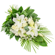 A long, front-facing funeral spray in white and green is displayed on a clean white surface, its shape running diagonally and tapering gently to the lower right like a calm, flowing river of petals and leaves. At the centre of the composition, several large white lilies open widely, their broad petals forming star-like shapes that cradle soft yellow-green stamens, while a few closed buds introduce height and anticipation. Around them cluster creamy white roses and ruffled carnations, their textures intermingling with simple, daisy-like white Gerbera blooms with subtle, darker or pale yellow centres. Delicate sprays of tiny white filler flowers are tucked among the main blossoms, lending a fine, cloudlike layer that softens the overall look. Surrounding this heart of blooms, the foliage is abundant and thoughtfully arranged: shiny broad leaves build a deep green frame; light, feathery fern strips break up the density; and rounded eucalyptus foliage in a muted blue-green adds cool contrast. At the upper portion of the spray, slender green leaves are folded and gathered in tidy loops, leading the eye upward, while from the lower right, multiple slim palm fronds arc outward in a fan, emphasizing the spray's elongated, contemporary profile. The design feels composed yet gentle, perfectly suited as a sympathy tribute for a service in New Barnet, perhaps resting in a quiet chapel or by a graveside. Its restrained palette of white and green speaks of purity, respect, and peace, offering a softly spoken farewell and a visual focus for reflection during moments of remembrance.