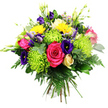 Against a bright white background, a lush, rounded hand-tied bouquet is captured in crisp detail, as if resting on the counter of a New Barnet flower shop. At the core, hot pink roses bloom fully, each one a swirl of velvety petals that instantly catches the eye. Around them, lime green spider chrysanthemums fan out in lively, spidery spokes, their fine, elongated petals bringing a playful, contemporary texture to the design. Deep indigo and royal purple lisianthus are scattered through the arrangement, providing pockets of rich, velvety colour; some flowers open in soft, bell-like layers, while others remain as elegant buds. Several bright yellow gerbera daisies lift their open, daisy-style faces, their sunny hue evoking the warmth of a clear day over nearby Victoria Park. A single cream or pale yellow rose bud sits gently among the foliage, its tightly curled petals adding a quieter touch of elegance. Tiny lavender and blush-toned filler flowers are threaded throughout, and slender green buds stretch delicately upwards, lending height and a sense of fresh growth. The whole bouquet is cradled by abundant dark green foliage, including smooth, glossy leaves, delicate fern fronds, and rounded, eucalyptus-like sprigs that frame and support the colourful blooms. Bound together in a classic hand-tied finish, the stems are visible at the base, suggesting a bouquet ready to be placed straight into a waiting vase. This exuberant mix of pink, yellow, purple, and green feels joyful and celebratory, ideal for sending congratulations, birthday wishes, or a bright thinking of you message to someone in New Barnet and the surrounding EN4 neighbourhoods.