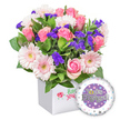 At the heart of a bright New Barnet baby celebration sits a lush bouquet for a new baby girl, presented in a crisp white cube vase that glows in soft morning light. The arrangement pairs several large pink roses, from tight buds to fully opened blooms, their petals soft with cream and blush tones. Nestled beside them are cheerful light pink gerbera daisies, their white-edged petals radiating warmth with pale yellow centers. Interspersed among the roses and gerberas are tiny clusters of vivid purple filler blooms, statice or limonium, adding depth and playful texture. Lush green foliage spills around the blooms, providing a fresh, garden-like backdrop that makes the colors pop. The front of the cube bears a delicate feminine script and a tiny red ladybug charm for good luck. To the lower right, a round Mylar balloon floats-lavender in hue, featuring a sweet sleeping baby illustration on a cloud and the baby girl message in soft pink lettering. The whole look feels joyful, tender, and hopeful, a perfect newborn gift or baby-shower gesture. It's crafted by a skilled local florist and available for delivery across New Barnet and its surrounding streets, including the High Street and Oakleigh Road North, filling homes with gentle fragrance and celebratory color for the arrival of a little girl.