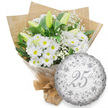 A refined silver anniversary gift set is shown against a bright white backdrop, capturing the serene beauty of white flowers and silver details. On the left, a hand-tied bouquet brims with white chrysanthemum daisies, their petals crisp and neat around lively yellow centres that give a soft, joyful glow. Nestled among them are several white lily buds, long and elegantly tapered, still tightly closed with hints of pale green along the edges, suggesting the bouquet will continue to change and open over several days. Wispy sprays of baby's breath wind between the larger blooms, adding a veil of tiny white blossoms that lend the arrangement a dreamy, cloudlike quality. The flowers are supported by rich green foliage, leaves of varying shapes and sizes layering behind the blooms to create depth, contrast, and a sense of natural abundance. Everything is wrapped first in clear cellophane, which reflects the light subtly, and then in warm brown kraft paper, folded around the stems in a tidy cone and tied securely at the bottom, giving it a rustic yet polished feel typical of a small independent florist in New Barnet. To the right sits a round silver foil balloon with a softly crinkled sheen, positioned just in front of the bouquet. Its face is delicately decorated with swirling scroll patterns and floral motifs in deeper silver-grey, framing a large, graceful 25th in flowing script. Behind the central text, the words Happy Anniversary appear faintly in repeated lines. The overall impression is of a calm, elegant tribute to twenty-five years together, perfect for a Silver Anniversary celebration at home or a favourite restaurant in New Barnet.
