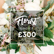 With the soft focus of a wedding bouquet, this image presents a lush, softly blurred arrangement in the background, overlaid by a dark semi-transparent panel that carries the Florist Choice branding. The floral design blends white and cream blossoms-full-headed garden roses, peonies, perhaps with pale pink spray roses or small filler flowers-set among eucalyptus and varied greenery. The greens include elongated olive branches and silvery eucalyptus, plus tiny white-green berries along leafy stems. The overall aesthetic is elegant, natural, and slightly rustic, suggesting a premium gift for a sophisticated celebration or a romantic wedding arrangement. The central overlay box holds two lines: Florist Choice in white script on top, CHOICE in uppercase beneath; the price ?300 in bold white text dominates the bottom of the frame. This image is designed as an e-commerce product listing or banner for a local North London florist, signaling a high-value bespoke bouquet with curated selection by a professional florist. It communicates quality, expertise, and value for premium flower delivery for events, anniversaries, or congratulatory gifts across New Barnet, nearby Whetstone, and the surrounding neighbourhood, with same-day delivery available. The composition invites the eye to linger on texture and light, letting the bouquet's natural beauty stand out against a softly warm backdrop. Placed as a feature on a site banner or product card, the image conveys a sense of craft and provenance, promising careful handling and fresh blooms from local growers. For customers planning birthdays, anniversaries, or corporate gifts in New Barnet and the surrounding streets, this Florist Choice option offers a reliable, elegant solution, with same-day delivery available across the area and weekday service from a trusted local florist.
