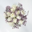 Serene elegance takes shape in this bouquet-a harmonious assembly of creamy white roses and clouds of lavender statice, composed with a craftsman's touch by Flowers New Barnet for neighbours across the area. Each rose is full and velvety, its heart unfurling amid the cool embrace of papery, pastel purple statice that billow like morning mist along Somerset Road. There's enchantment here, the gentle interplay of smooth petals and delicate lavender florets creating both visual interest and a sense of soft hope. Natural daylight amplifies the bouquet's palette, casting pure, uplifting tones reminiscent of tranquil new beginnings-fitting for weddings at local venues or for heartfelt celebrations at home. The arrangement feels like a pause, inviting calm and romantic reflection, its almost powdery, ephemeral fragrance lingering quietly in the air like a spring dawn. Every detail signals authenticity: the locally sourced blooms, the artful spiral of petals, the echo of gentle affection. This bouquet, thoughtfully designed in New Barnet, promises sincerity and lasting comfort, delivering understated beauty and emotional warmth to anyone who receives it.