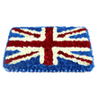 A carefully constructed Union Jack floral tribute fills the frame, set against a plain white background so every detail of the design stands out. The tribute is rectangular with a softly domed surface, giving the impression of a cushioned flag resting in quiet dignity. Deep blue chrysanthemums create the solid base, forming a smooth, uniform field of colour that resembles a rich, evening sky over New Barnet. On top of this, crisp white flowers define the strong vertical and horizontal lines of St George's Cross and the supporting diagonals, each petal placed with care to maintain sharp, even edges. Over these white sections, bands of vivid red carnations mark the remaining elements of the Union Jack, edged delicately with white blooms so the intricate pattern remains clear and accurate. The red flowers have a plush, velvety texture, with slightly curled petals that add depth and movement, while the white and blue blossoms lend a sense of calm balance. At the base, a pleated blue satin ribbon forms a neat border, its gentle sheen reflecting light and giving the tribute a polished, finished look, as though prepared for an important ceremonial occasion. The flowers appear fresh and cool, suggesting a subtle, clean fragrance typical of newly arranged chrysanthemums and carnations delivered straight from a local workshop. This piece is perfectly suited for a patriotic farewell, perhaps for a service in one of New Barnet's churches or a memorial gathering for someone with strong ties to the armed forces or public service. It conveys honour, remembrance, and quiet pride, the kind of respectful statement a family might choose when they wish to celebrate both personal memories and a shared British identity.
