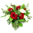 In this image, a sophisticated bouquet of red roses and white calla lilies is arranged in a clear glass vase and set against a bright white background, creating a clean, modern frame for a very classic romantic design that would feel at home in any New Barnet apartment or townhouse. At the core of the composition, around six or seven red roses are fully opened, their velvety petals arranged in tight, spiraling layers that show off a rich, almost velour-like crimson. Interwoven among the roses are several white calla lilies, each one arching gracefully upward, their smooth, waxy petals forming elegant trumpet shapes that cradle slender yellow spadices. The contrast between the bold red and crisp white blooms is softened by generous greenery: delicate sprays of eucalyptus with their small, rounded, blue-green leaves create a gentle halo around the flowers, while larger, darker green leaves support the base of the bouquet and give it a full, domed profile. The stems of the flowers and foliage are clearly visible through the transparent, subtly ribbed vase, their natural shades of green gathered neatly in clear water, suggesting they have been freshly arranged by an experienced local florist. Strong, even lighting brings out the saturation of the roses, the creamy luminosity of the callas, and the varied greens of the foliage, without any distracting shadows in the background. The arrangement feels poised and intentional, like a gift chosen to mark a meaningful moment-a proposal celebrated at home near Victoria Park, an anniversary dinner in New Barnet, or a special same-day delivery to say I love you when words aren't quite enough.

