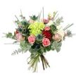 A hand-tied bouquet photographed against a crisp white background, its colours and textures described as if held close to the face: at the centre a voluminous cluster of lime-green hydrangea blooms creates a soft, cloud-like mass of tiny petals that seem to glow in the light. Surrounding this heart are several roses in varied stages of opening - deep, velvety red roses that read as rich and romantic, alongside tender pastel pink and cream roses that unfurl in softer, more intimate spirals. Scattered among the roses are coral-pink carnations with their ruffled, frilled edges, offering lively, tactile contrast and a warm, cheerful note. Cutting across the softer shapes are architectural blue-grey Eryngium thistles; their spiky, star-like heads introduce a cool, steel-blue accent and a slightly wild, textural bite. The bouquet is luxuriously filled with greenery: silvery-green eucalyptus leaves lend a subtle, aromatic freshness and round shapes that calm the composition, while long, thin blades of bright green grass or filler foliage reach upward and outward to add movement and lightness. The stems are neatly gathered and bound with a natural-coloured tie, the cut green stems visible at the base and suggesting recent, careful handling. Lit with soft, even daylight that highlights petal edges and the eucalyptus sheen, the arrangement reads as both contemporary and timeless - suitable for birthdays, anniversaries, Mother's Day, or as an elegant home accent. As a local florist might note in New Barnet, the design carries a breezy, neighbourhood warmth, the kind of bouquet you might bring from a walk past Oak Hill Park to brighten a neighbour's morning.