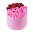In a refined product-shot made for New Barnet's romance-seekers, a luxurious floral display sits centered against a crisp white background. The main feature is a soft pink velvet cylindrical hatbox that acts as a generous cradle for the blooms, its plush surface inviting the eye and the fingers alike. Inside, dozens of roses fill the opening to the brim, their heads fully open and arranged with quiet precision. The overall look is calm, elegant, and undeniably festive, as if prepared for a special moment in a bright North London living room. Color is staged with purposeful contrast: the top portion holds roughly a dozen deep crimson red roses arranged in a curved crescent, hinting at a heart or a gentle division within the box. The lower half blooms in bright fuchsia pink, offering a lively, modern counterpoint that remains sophisticated. The two blocks balance each other so that the arrangement feels both generous and intimate, a contemporary celebration of romance rather than a loud statement. Each rose shows layered petals, the petals with a soft, velvety texture and a subtle sheen that catches light from the studio lamp. The scent-delicate and uplifting-lingers just long enough to greet you as you step closer. This is a luxury gift box designed to brighten anniversaries, Valentine's moments, or elegant home décor with a touch of theatre. For those in New Barnet seeking reliable gifting, this bouquet is prepared with care and delivered in pristine condition. From Flowers New Barnet, this refined arrangement is available for same-day delivery across New Barnet and neighboring districts, ensuring a fresh, premium gift can arrive swiftly. The clean, product-shot presentation makes it an ideal feature image for luxury floral gifts, premium rose boxes, or thoughtful presents that speak of taste and affection. It embodies craft, freshness, and the quiet confidence of a mature, celebratory gesture.