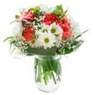 This bouquet, carefully arranged by passionate florists in the heart of New Barnet, glows with joyful hues and a welcoming freshness. At its center, plush coral-pink carnations ripple with intricate, ruffled petals, their lively colour balanced by the surrounding white chrysanthemums, echoing the bright facades of local shops. Small, classic daisies dot the design with their charming green-centered faces, infusing youthful innocence reminiscent of family afternoons in Oakhill Park. Tucked gently to the left, closed magenta alstroemeria buds bring a promise of change-a subtle pop among established blooms. Wisps of white baby's breath lend the bouquet a dreamy softness, their tiny blossoms like floating clouds around robust blooms. A collar of deep green, glossy leaves forms an elegant base, while longer, slender leaves add light movement and a touch of the local hedgerows to the bouquet. Crystal-clear water in a simple glass vase enhances the natural beauty by revealing sturdy green stems, a testament to both freshness and fine craftsmanship. With gentle, even light illuminating every petal-free from harsh shadows-this arrangement is as fitting for new beginnings as for heartfelt thank yous. Whether brightening a kitchen in a Victorian townhouse or being hand-delivered for a birthday celebration along Station Road, this bouquet radiates easy grace and subtle cheer, bringing the spirit of New Barnet indoors.